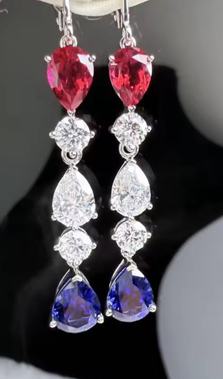 Close view of the Americana French-hook drop earrings showing the red lab-created ruby, white lab-grown diamond and blue lab-created sapphire teardrops